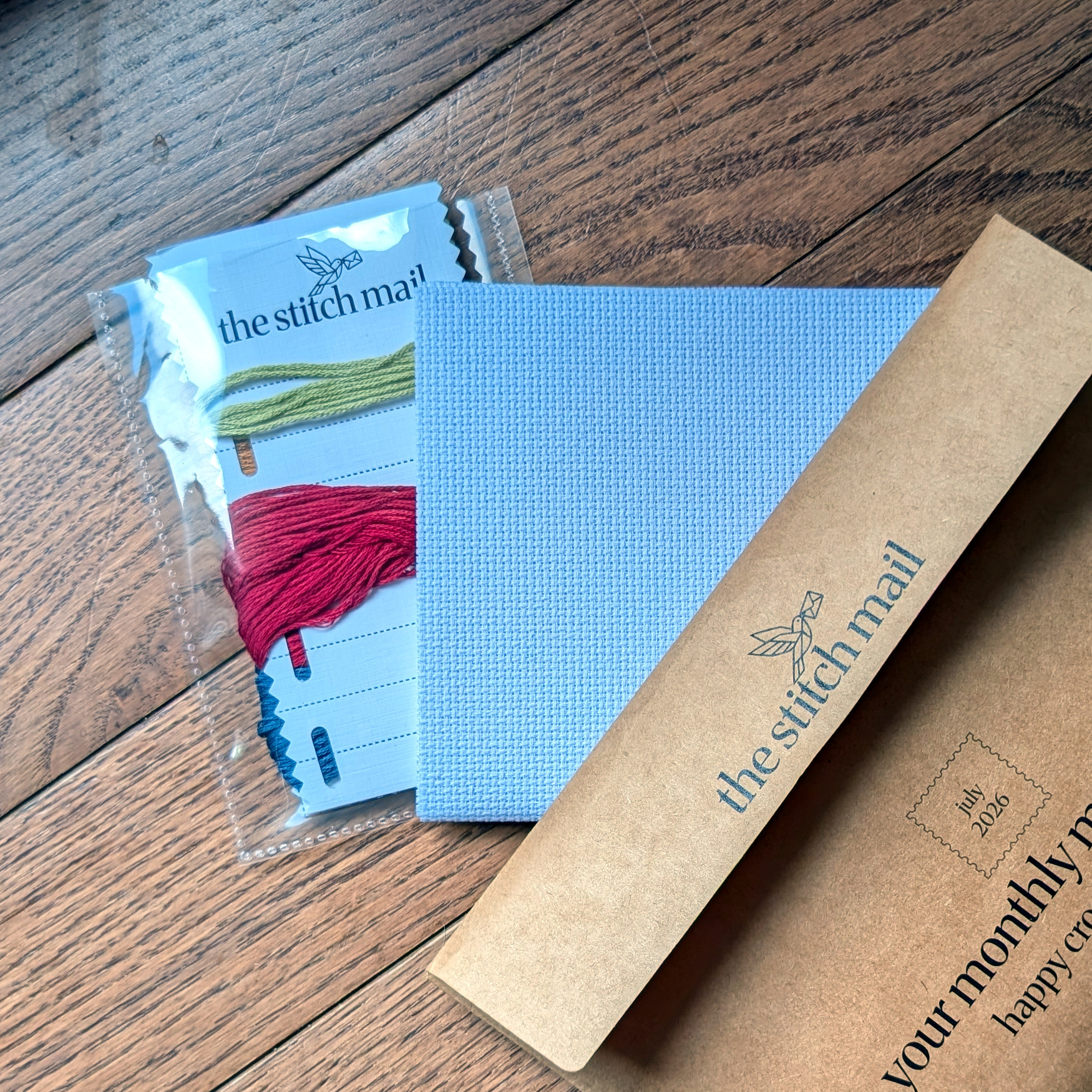 Embroidery floss and a piece of 14-count Aida cloth